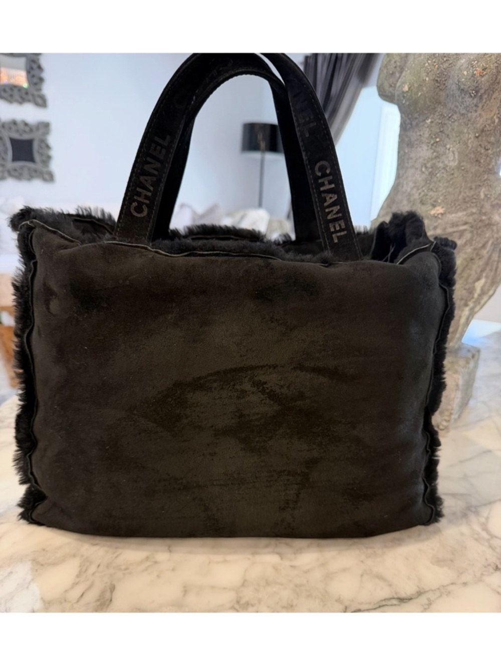 CHANEL 
🔥 Black Chanel shearling tote – hard to find in this condition
